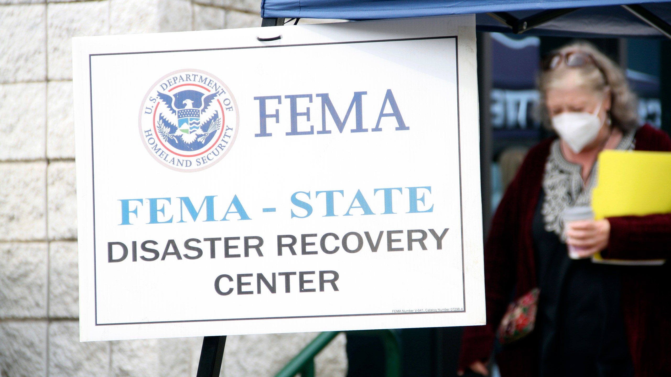 People gather at a FEMA Disaster Recovery Center at A.C. Reynolds High School in Asheville, N.C.,, Tuesday, Oct. 15, 2024. (AP Photo/Makiya Seminera)