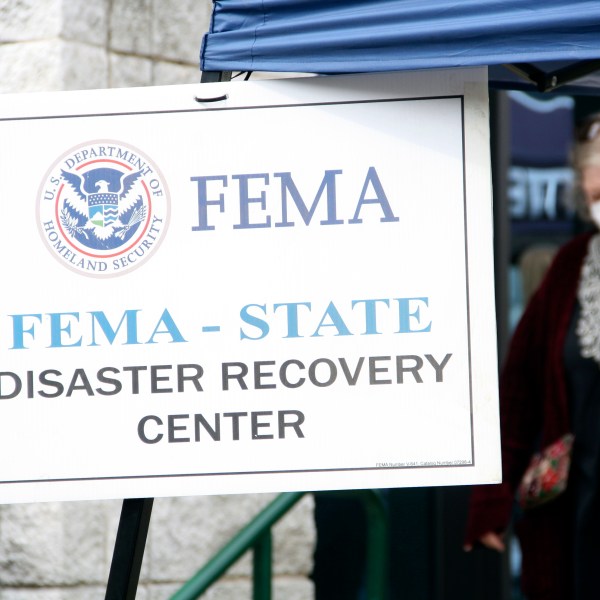 People gather at a FEMA Disaster Recovery Center at A.C. Reynolds High School in Asheville, N.C.,, Tuesday, Oct. 15, 2024. (AP Photo/Makiya Seminera)