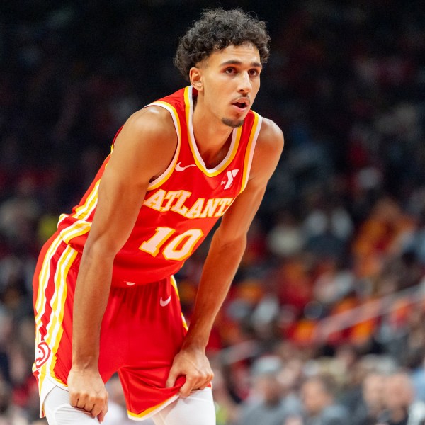 Atlanta Hawks forward Zaccharie Risacher (10) waits to attempt his free throws during the first half of an NBA basketball game against the Brooklyn Nets, Wednesday, Oct. 23, 2024, in Atlanta. (AP Photo/Jason Allen)