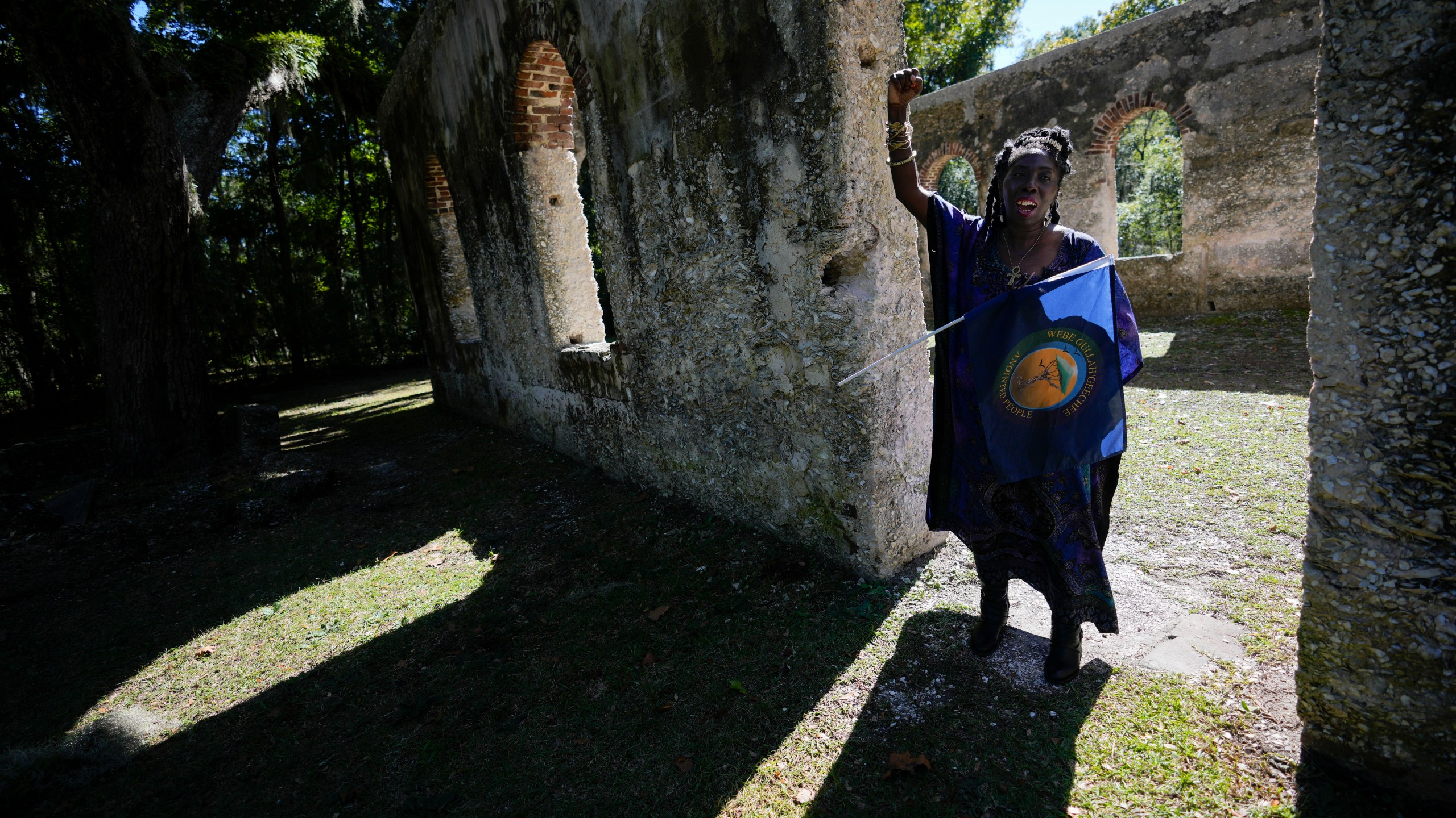 FILE - Marquetta Goodwine, a local community leader who is also known as "Queen Quet", speaks to Associated Press journalists about Gullah Geechee history, at the ruins of the Chapel of Ease, where plantation owning families would attend church services, on St. Helena Island, S.C., on Oct. 29, 2021. (AP Photo/Rebecca Blackwell, File)