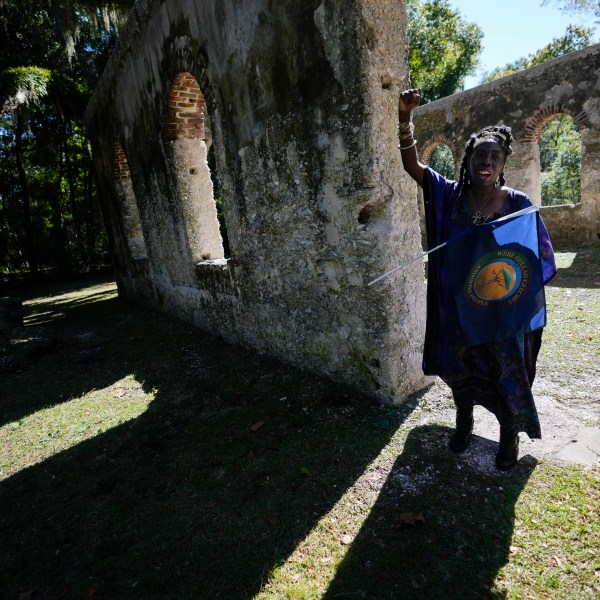 FILE - Marquetta Goodwine, a local community leader who is also known as "Queen Quet", speaks to Associated Press journalists about Gullah Geechee history, at the ruins of the Chapel of Ease, where plantation owning families would attend church services, on St. Helena Island, S.C., on Oct. 29, 2021. (AP Photo/Rebecca Blackwell, File)