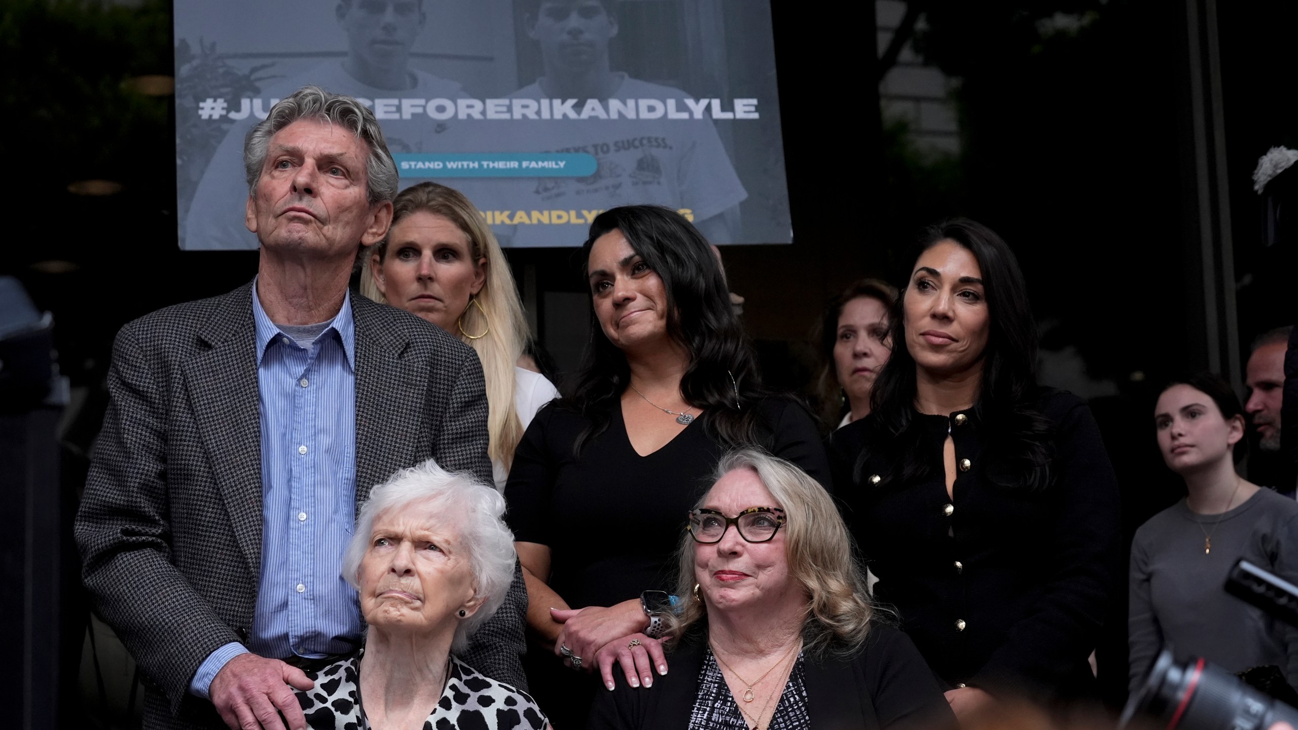 FILE - Kitty Menendez's sister, Joan Andersen VanderMolen, bottom left, and niece Karen VanderMolen, right, sit together during a press conference to announce developments on the case of brothers Erik and Lyle Menendez, Wednesday, Oct. 16, 2024, in Los Angeles. (AP Photo/Damian Dovarganes, File)