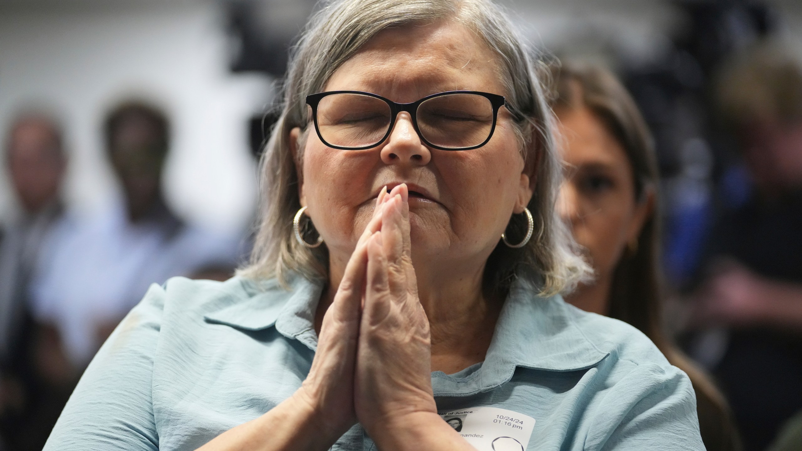 Diane Hernandez niece of Kitty Menendez sits prior to a news conference being held by Los Angeles County District Attorney George Gascon at the Hall of Justice on Thursday, Oct. 24, 2024, in Los Angeles. (AP Photo/Eric Thayer)