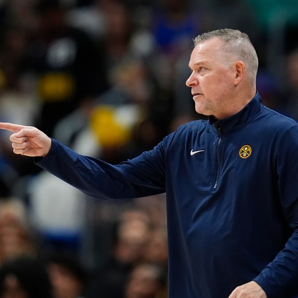 Denver Nuggets head coach Michael Malone directs his team against the Oklahoma City Thunder in the second half of an NBA basketball game Thursday, Oct. 24, 2024, in Denver. (AP Photo/David Zalubowski)