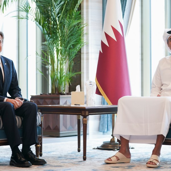 U.S. Secretary of State Antony Blinken, left, meets with Qatar's Emir Sheikh Tamim bin Hamad al-Thani in Doha, Qatar, Thursday, Oct. 24, 2024. (Nathan Howard/Pool Photo via AP)