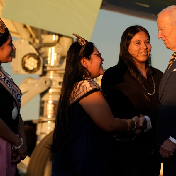 President Joe Biden greets people as he arrives at Phoenix Sky Harbor International Airport, Thursday, Oct. 24, 2024 in Phoenix. (AP Photo/Manuel Balce Ceneta)