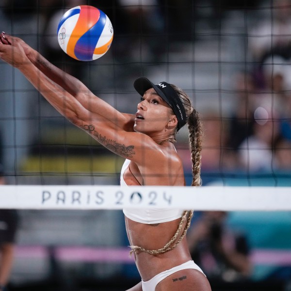 FILE - Canada's Brandie Wilkerson returns thea ball in the women's beach volleyball gold medal match between Brazil and Canada, at the 2024 Summer Olympics, Aug. 9, 2024, in Paris, France. (AP Photo/Louise Delmotte, File)