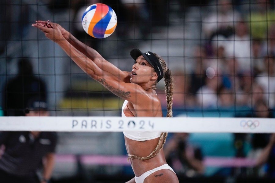 FILE - Canada's Brandie Wilkerson returns thea ball in the women's beach volleyball gold medal match between Brazil and Canada, at the 2024 Summer Olympics, Aug. 9, 2024, in Paris, France. (AP Photo/Louise Delmotte, File)