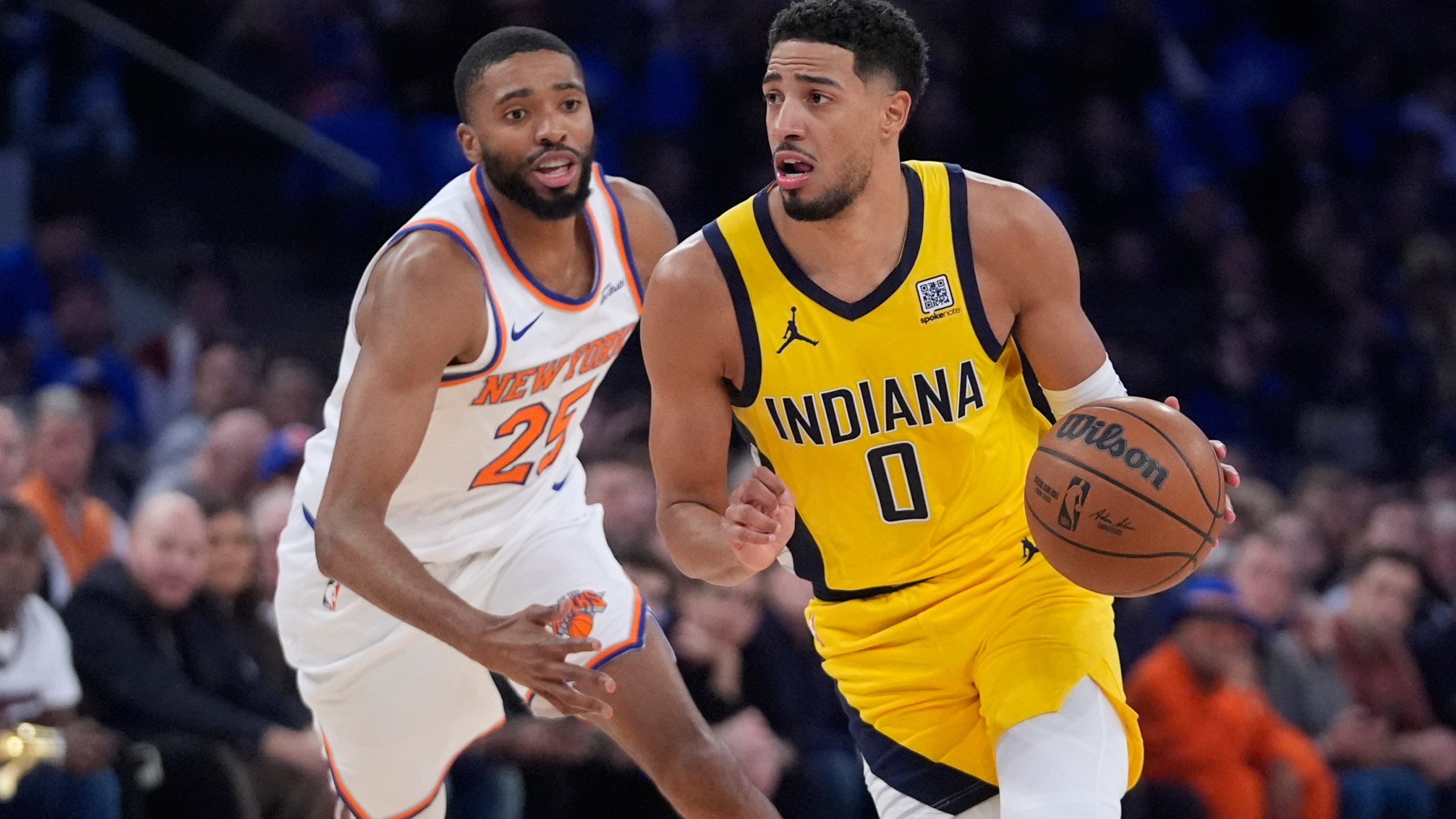 Indiana Pacers' Tyrese Haliburton (0) drives past New York Knicks' Mikal Bridges (25) during the first half of an NBA basketball game Friday, Oct. 25, 2024, in New York. (AP Photo/Frank Franklin II)