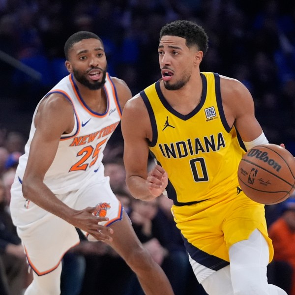 Indiana Pacers' Tyrese Haliburton (0) drives past New York Knicks' Mikal Bridges (25) during the first half of an NBA basketball game Friday, Oct. 25, 2024, in New York. (AP Photo/Frank Franklin II)