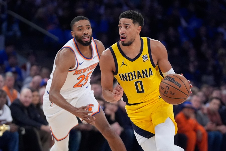 Indiana Pacers' Tyrese Haliburton (0) drives past New York Knicks' Mikal Bridges (25) during the first half of an NBA basketball game Friday, Oct. 25, 2024, in New York. (AP Photo/Frank Franklin II)