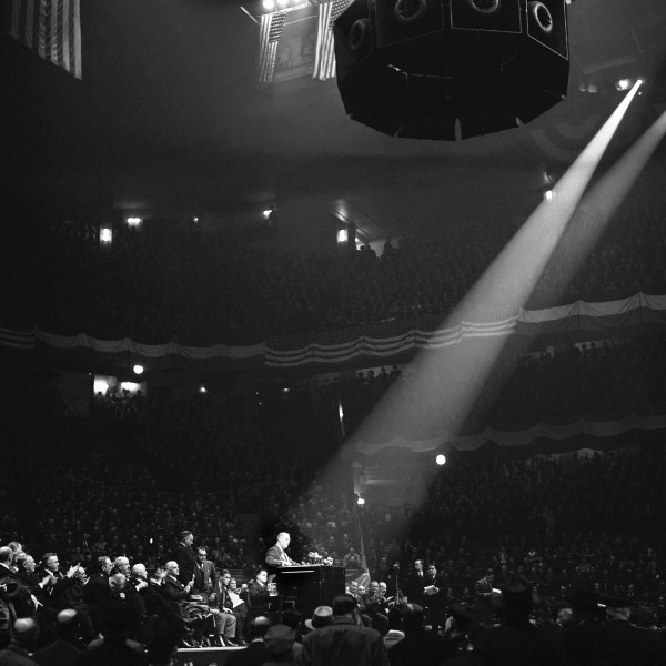 FILE - This is part of the crowd which packed New York City's Madison Square Garden on Oct. 28, 1940 to hear President Franklin Roosevelt charge in a campaign speech that the "responsible leadership of the republican party" had tried to "sabotage" increased defense appropriations and block aid to Britain prior to the present election campaign. (AP Photo/Harry Harris, File)