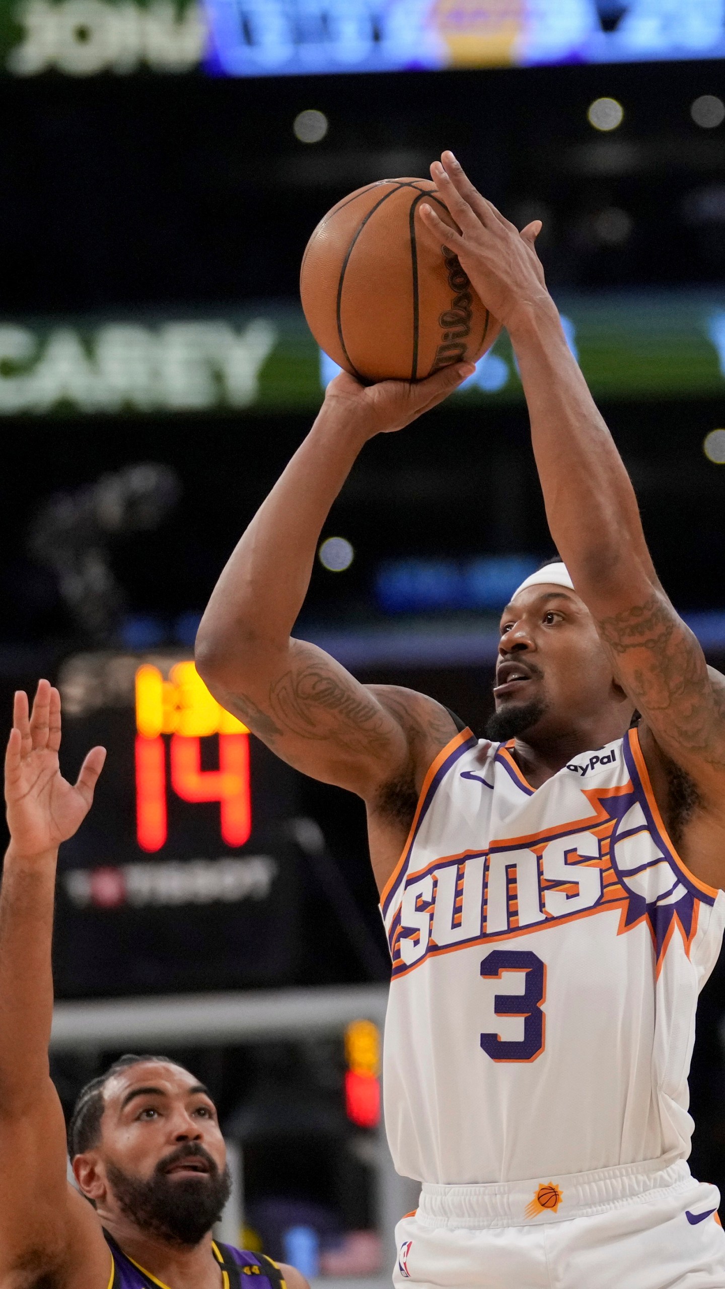 Phoenix Suns guard Bradley Beal (3) shoots over Los Angeles Lakers guard Gabe Vincent during the first half of an NBA basketball game against the in Los Angeles, Friday, Oct. 25, 2024. (AP Photo/Eric Thayer)