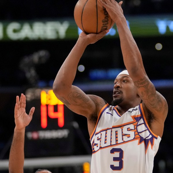 Phoenix Suns guard Bradley Beal (3) shoots over Los Angeles Lakers guard Gabe Vincent during the first half of an NBA basketball game against the in Los Angeles, Friday, Oct. 25, 2024. (AP Photo/Eric Thayer)