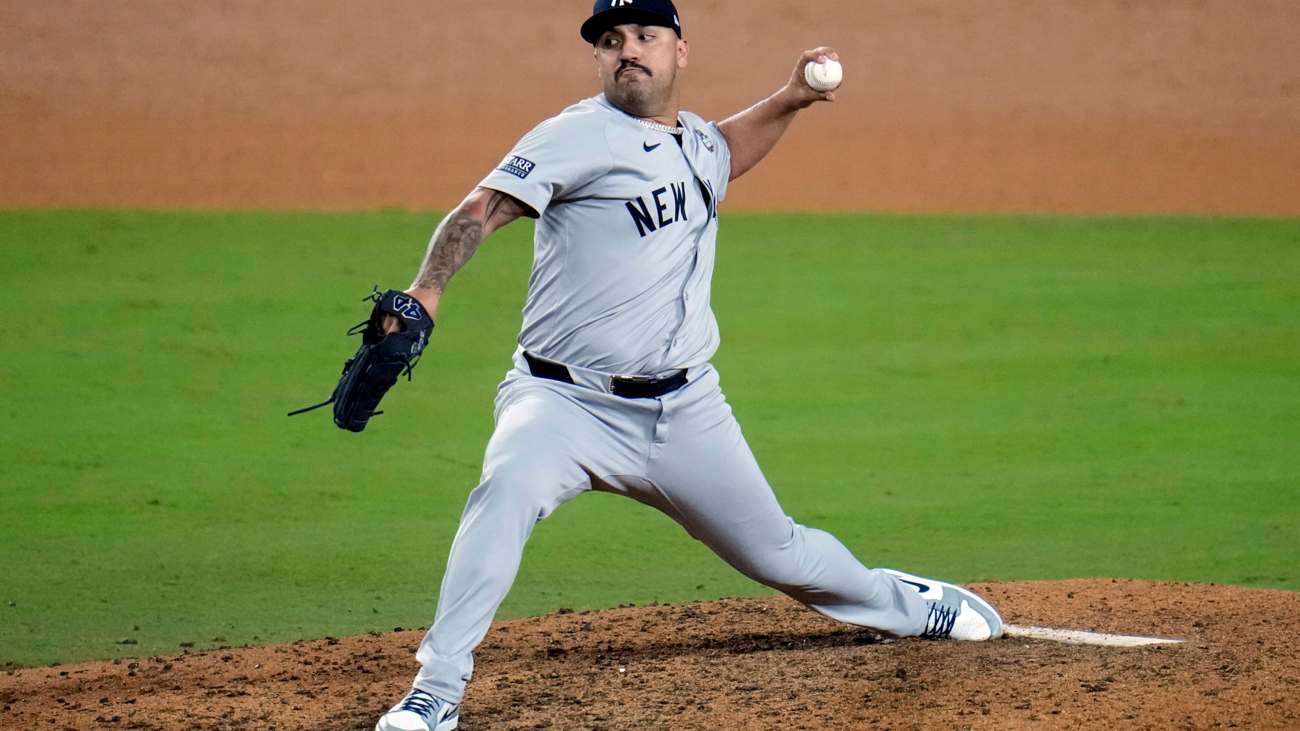 Los Angeles Dodgers pitcher Nestor Cortes throws against the Los Angeles Dodgers during the 10th inning in Game 1 of the baseball World Series, Friday, Oct. 25, 2024, in Los Angeles. (AP Photo/Julio Cortez)