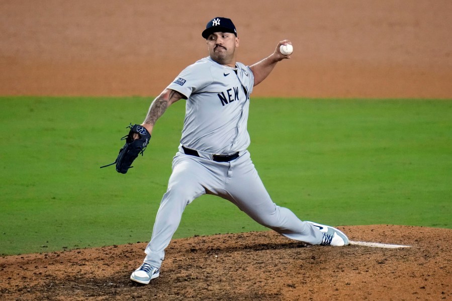 Los Angeles Dodgers pitcher Nestor Cortes throws against the Los Angeles Dodgers during the 10th inning in Game 1 of the baseball World Series, Friday, Oct. 25, 2024, in Los Angeles. (AP Photo/Julio Cortez)