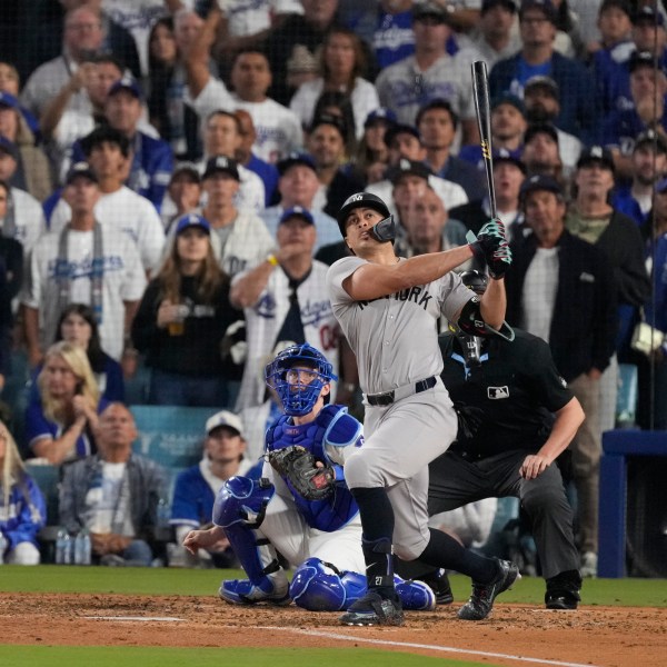 New York Yankees' Giancarlo Stanton watches his two-run home during the sixth inning in Game 1 of the baseball World Series against the Los Angeles Dodgers, Friday, Oct. 25, 2024, in Los Angeles. (AP Photo/Mark J. Terrill)