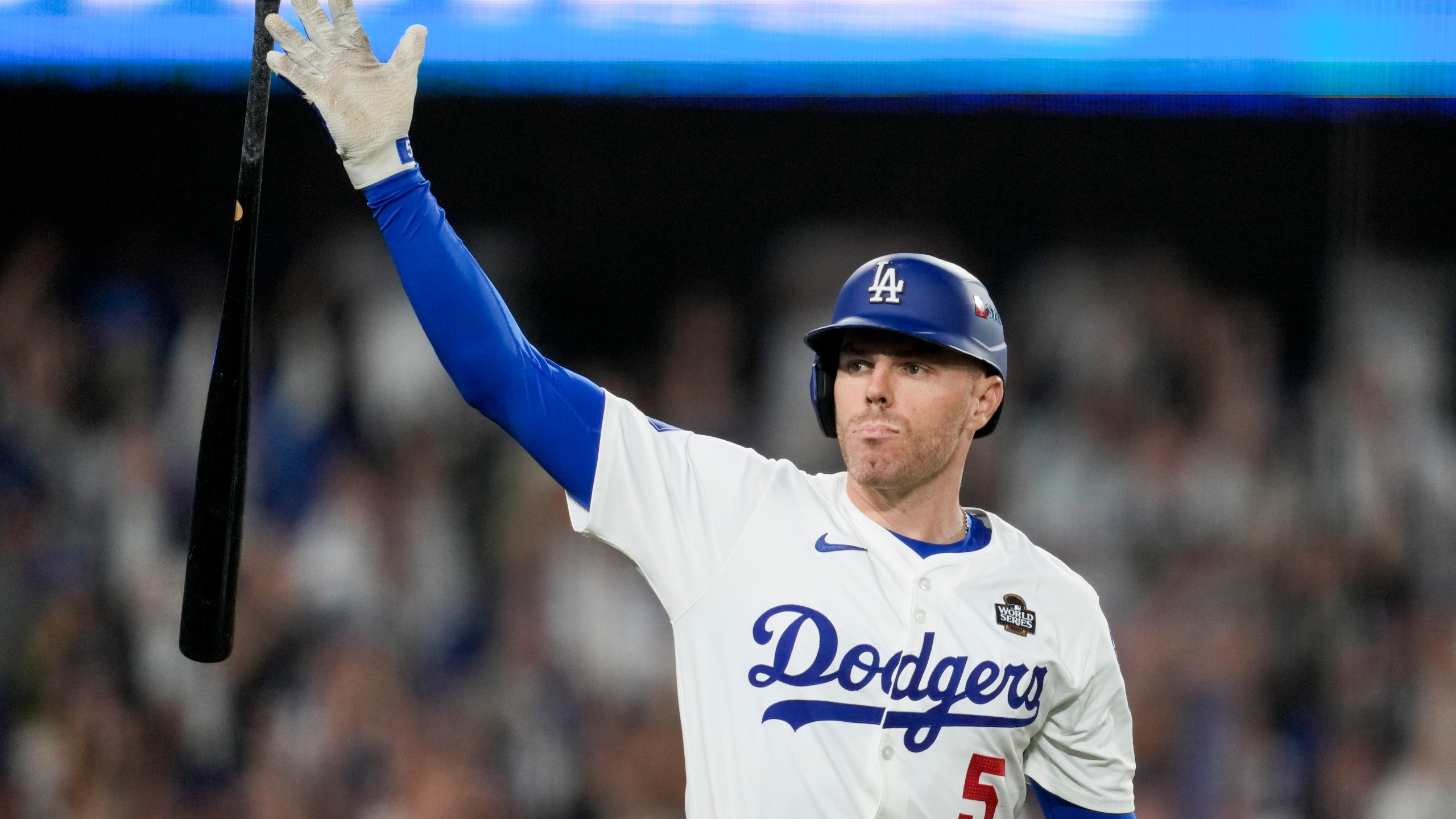 Los Angeles Dodgers' Freddie Freeman celebrates his walk-off grand slam home run against the New York Yankees during the 10th inning in Game 1 of the baseball World Series, Friday, Oct. 25, 2024, in Los Angeles. (AP Photo/Ashley Landis)