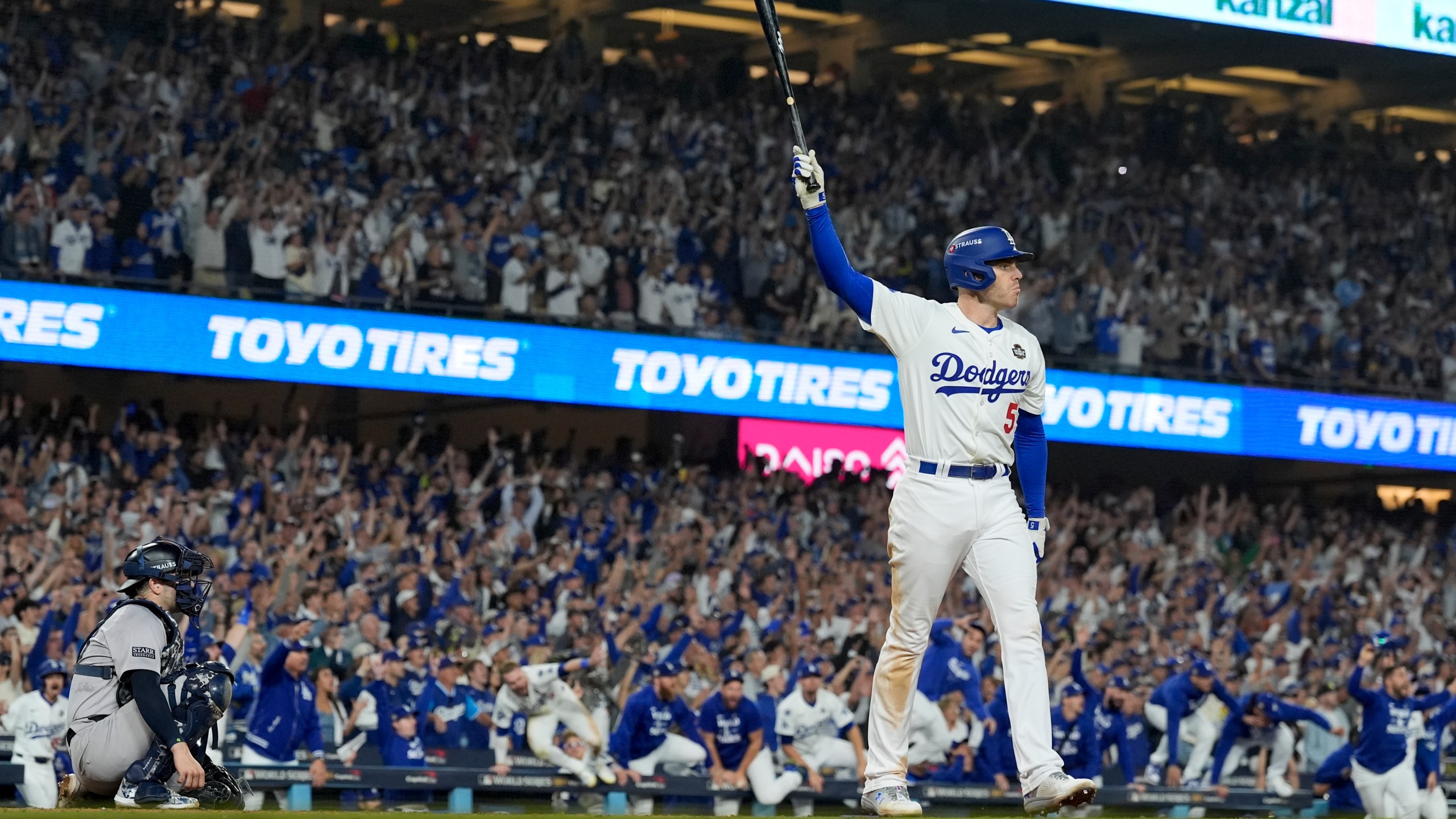 Los Angeles Dodgers' Freddie Freeman celebrates his walk-off grand slam home run against the New York Yankees during the 10th inning in Game 1 of the baseball World Series, Friday, Oct. 25, 2024, in Los Angeles. (AP Photo/Ashley Landis)