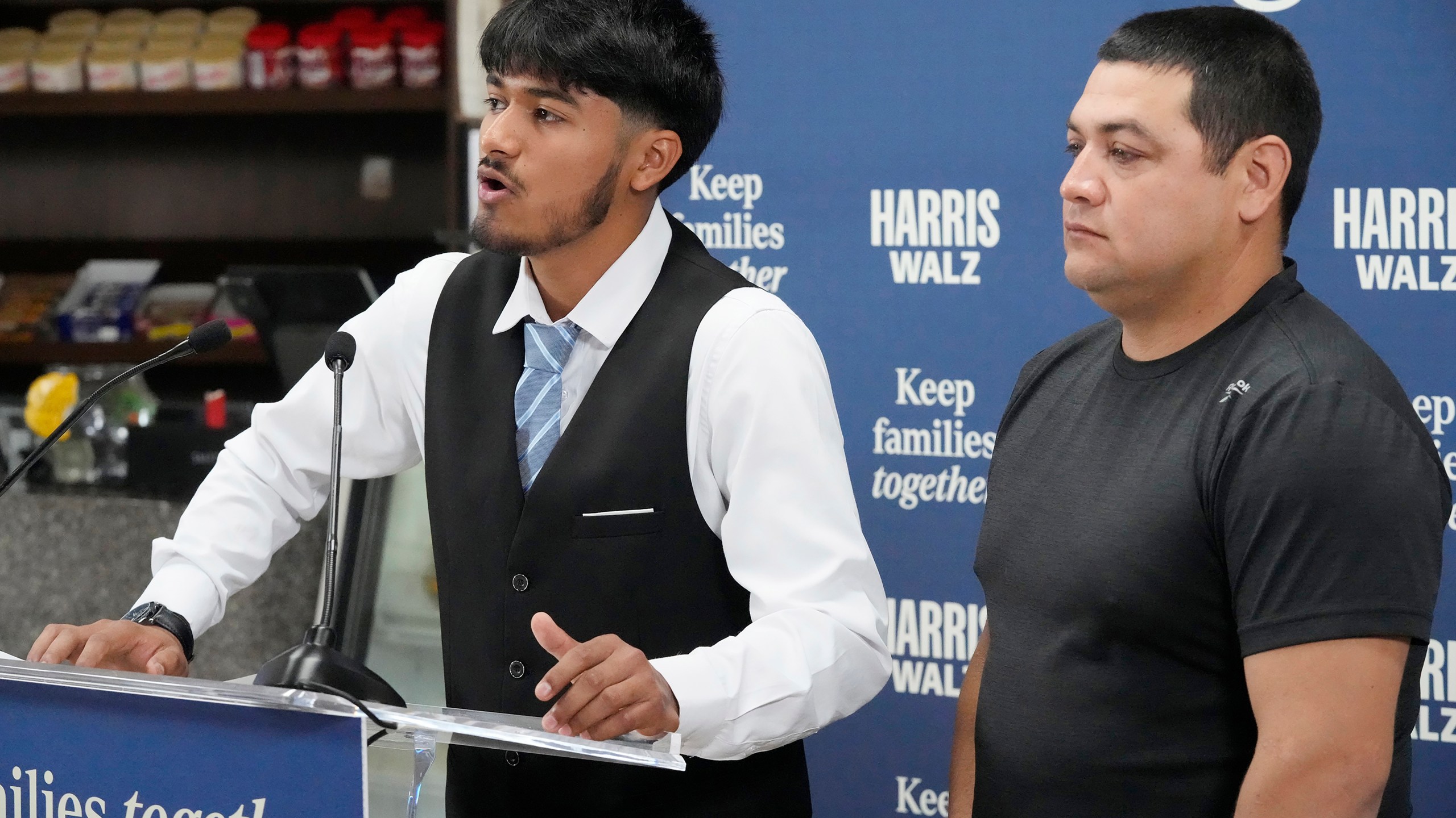 FILE - Billy and his father, no last name given, speak at a Democratic Party campaign event, about their experience of being separated when they crossed the U.S.- Mexico border during the Trump administration, Oct. 16, 2024, in Doral, Fla. (AP Photo/Marta Lavandier, File)