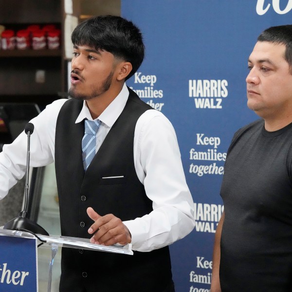 FILE - Billy and his father, no last name given, speak at a Democratic Party campaign event, about their experience of being separated when they crossed the U.S.- Mexico border during the Trump administration, Oct. 16, 2024, in Doral, Fla. (AP Photo/Marta Lavandier, File)