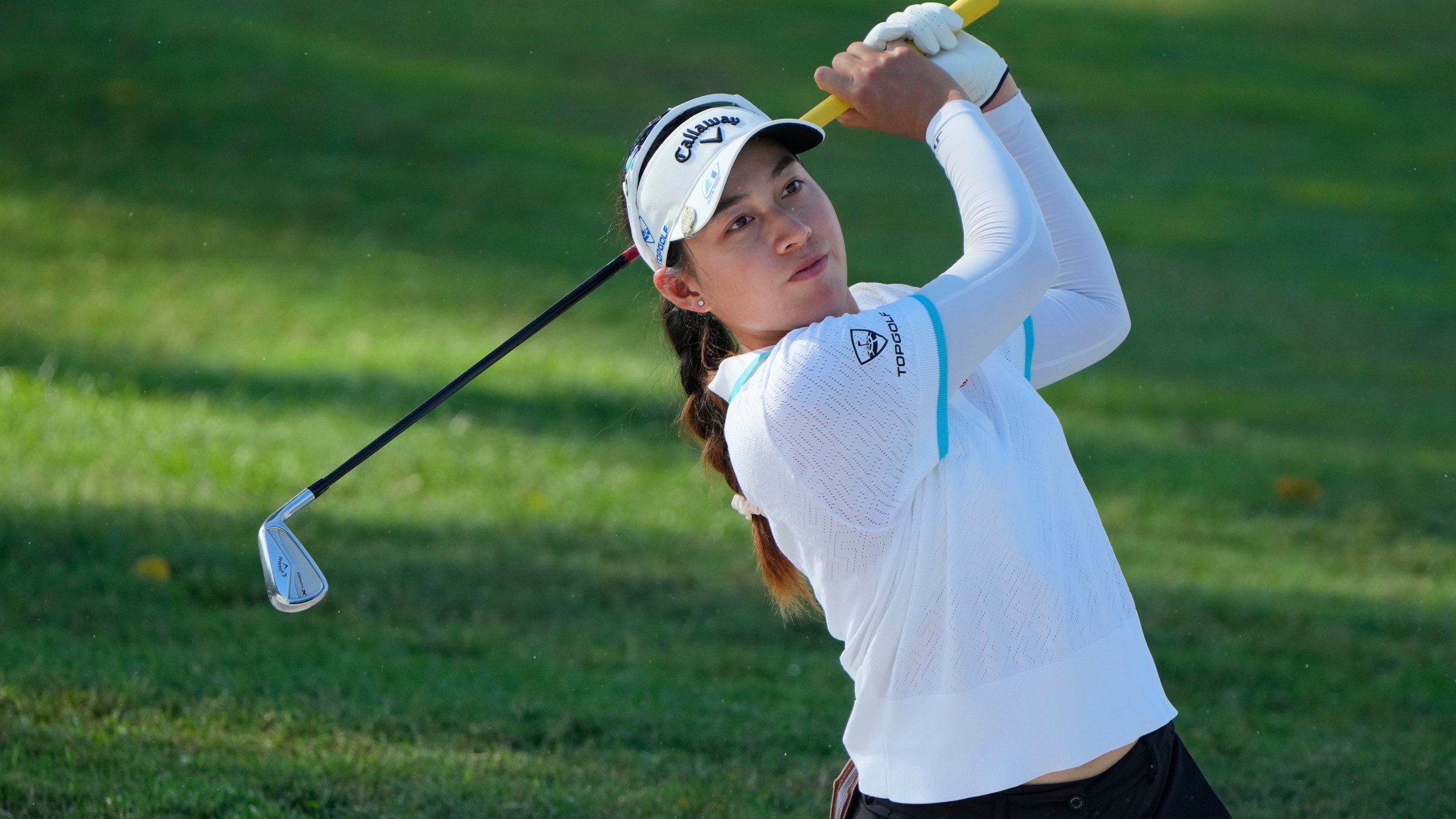 Jeeno Thitikul of Thailand watches her fairway shot on the third hole during the second round of Maybank LPGA Championship golf tournament at Kuala Lumpur Golf and Country club in Kuala Lumpur, Thursday, Oct. 24, 2024. (AP Photo/Vincent Thian)