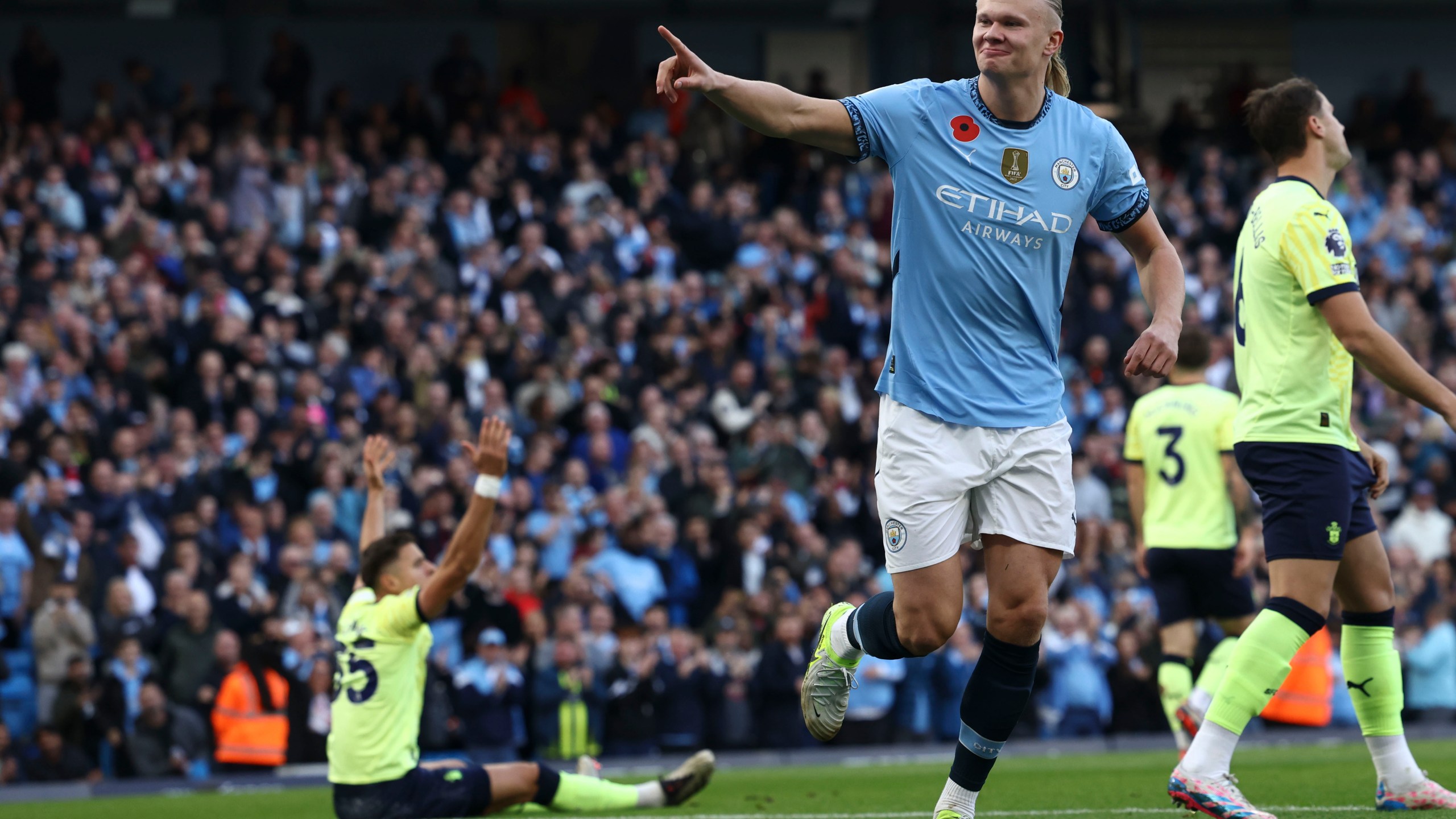 Manchester City's Erling Haaland celebrates after scoring his side's opening goal during the English Premier League soccer match between Manchester City and Southampton at the Etihad Stadium in Manchester, England, Saturday, Oct. 26, 2024. (AP Photo/Darren Staples)