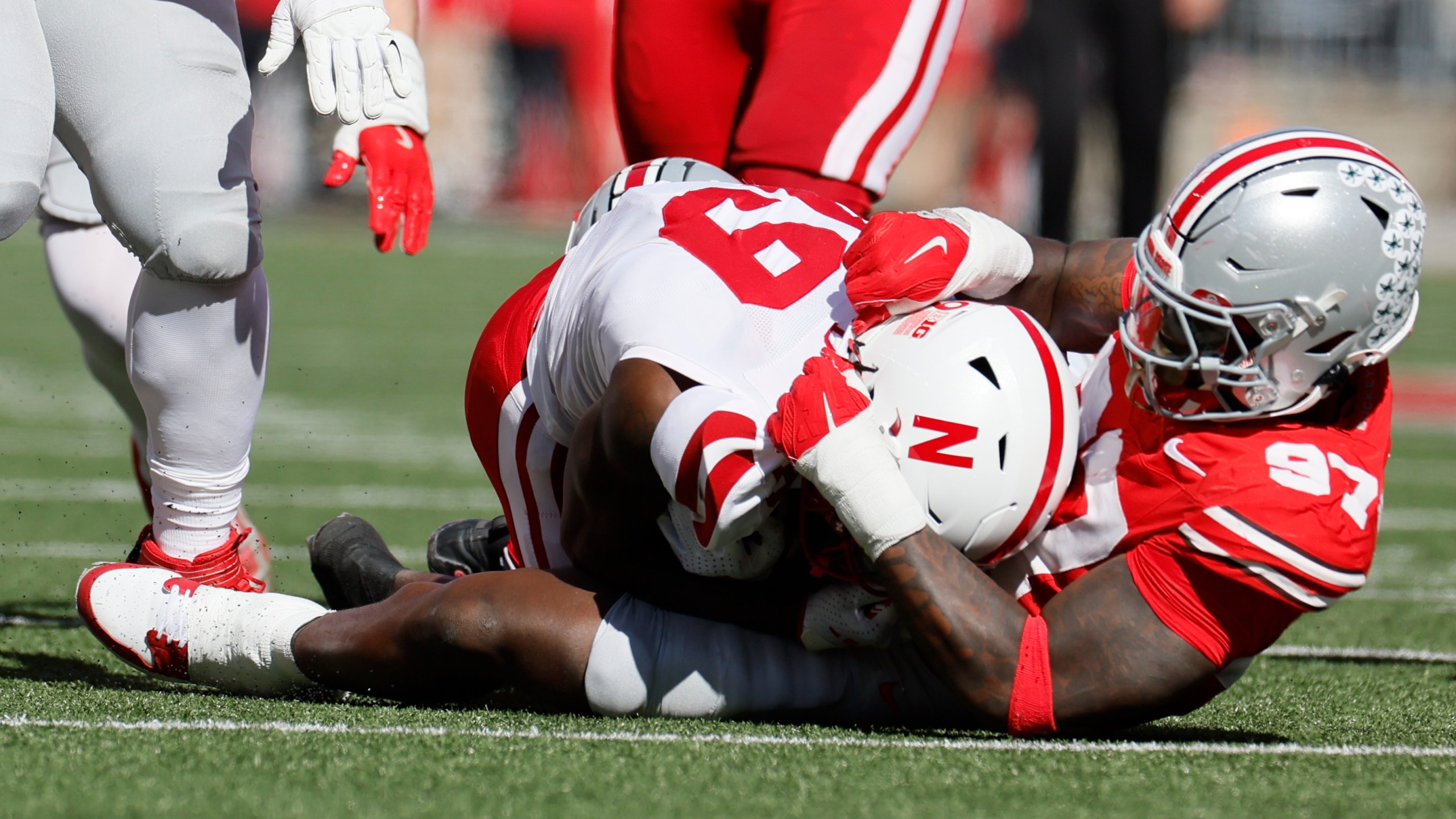 Ohio State defensive lineman Kenyatta Jackson, right, tackles Nebraska receiver Jaylen Lloyd for a loss during the first half of an NCAA college football game Saturday, Oct. 26, 2024, in Columbus, Ohio. (AP Photo/Jay LaPrete)