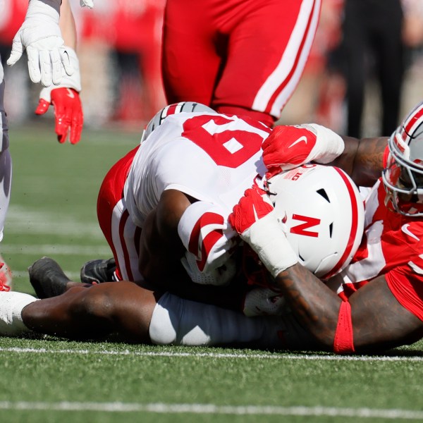 Ohio State defensive lineman Kenyatta Jackson, right, tackles Nebraska receiver Jaylen Lloyd for a loss during the first half of an NCAA college football game Saturday, Oct. 26, 2024, in Columbus, Ohio. (AP Photo/Jay LaPrete)