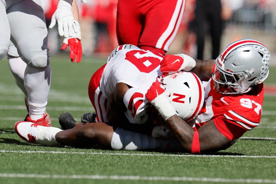 Ohio State defensive lineman Kenyatta Jackson, right, tackles Nebraska receiver Jaylen Lloyd for a loss during the first half of an NCAA college football game Saturday, Oct. 26, 2024, in Columbus, Ohio. (AP Photo/Jay LaPrete)