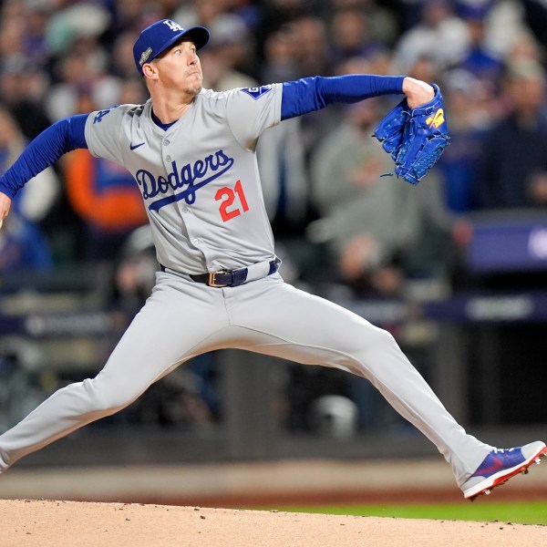 Los Angeles Dodgers pitcher Walker Buehler throws against the New York Mets during the first inning in Game 3 of a baseball NL Championship Series, Wednesday, Oct. 16, 2024, in New York. (AP Photo/Frank Franklin II)