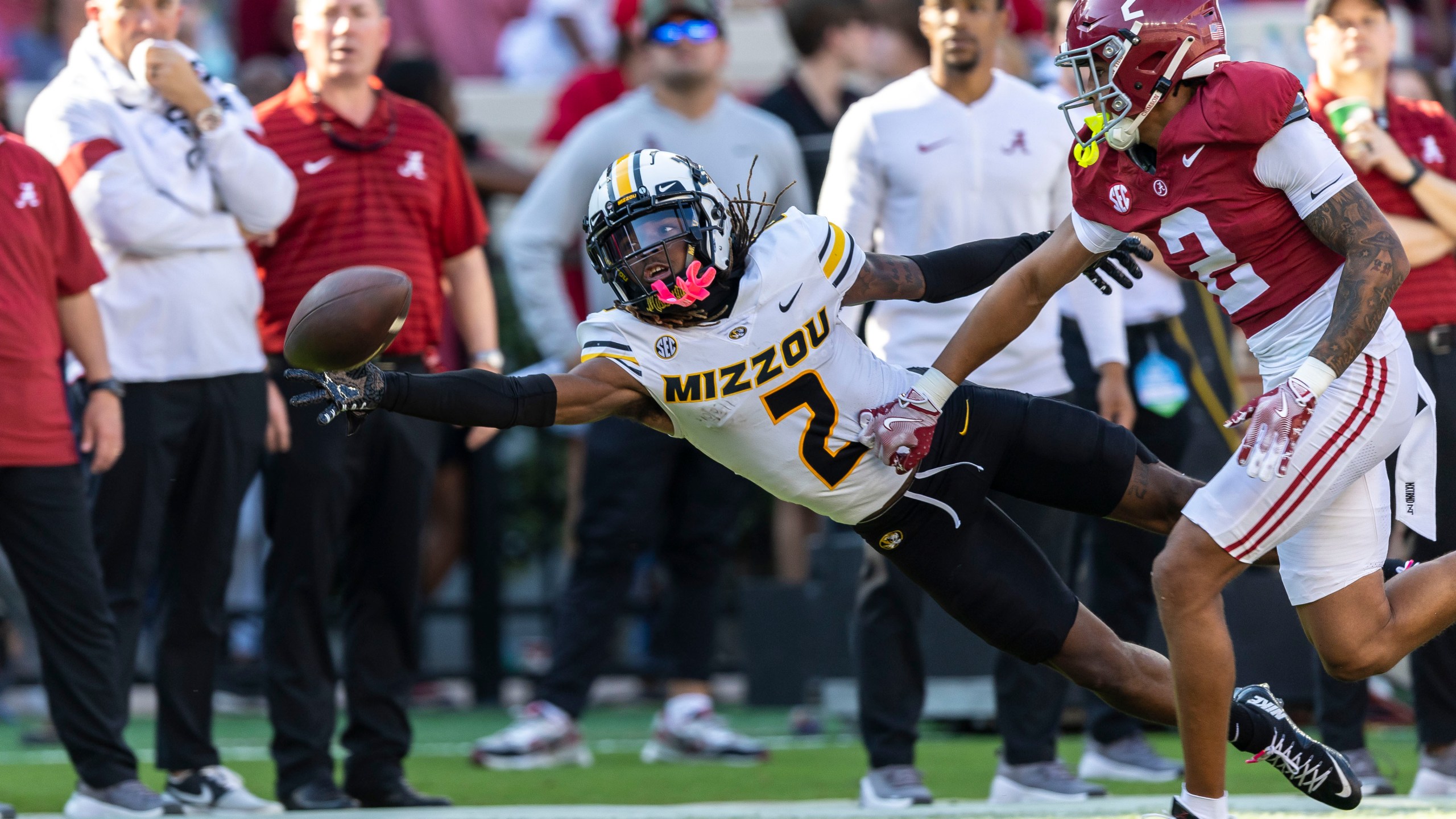 Missouri wide receiver Marquis Johnson, left, misses a pass as Alabama defensive back Zabien Brown, front right, defends during the first half of an NCAA college football game, Saturday, Oct. 26, 2024, in Tuscaloosa, Ala. (AP Photo/Vasha Hunt)