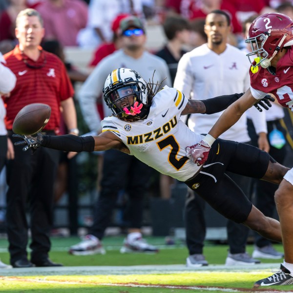 Missouri wide receiver Marquis Johnson, left, misses a pass as Alabama defensive back Zabien Brown, front right, defends during the first half of an NCAA college football game, Saturday, Oct. 26, 2024, in Tuscaloosa, Ala. (AP Photo/Vasha Hunt)