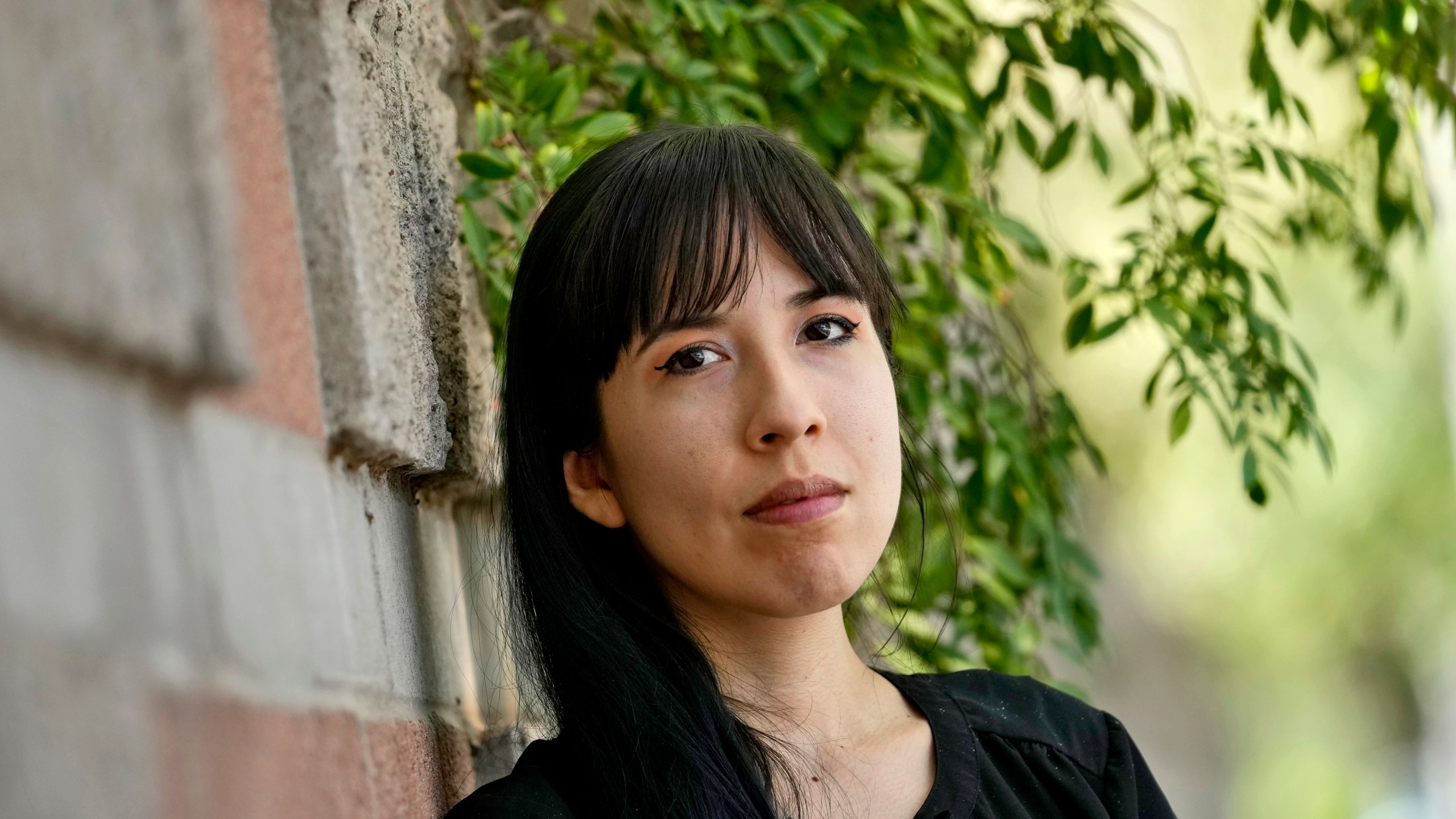 Jocelyn Ruiz, 26, pictured in Tempe, Ariz., Tuesday, Oct. 22, 2024, is a U.S. citizen who discovered a family secret that her mother could be deported at any time. (AP Photo/Matt York)