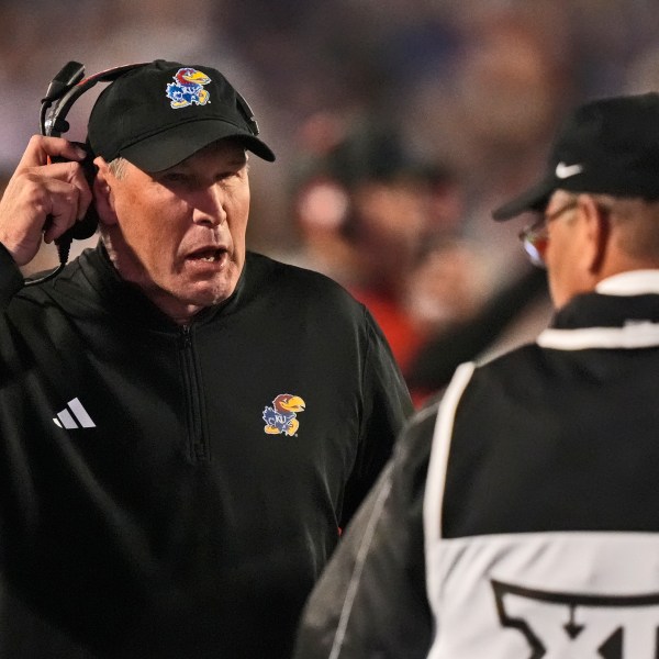 Kansas head coach Lance Leipold talks to an official during the first half of an NCAA college football game against Kansas State Saturday, Oct. 26, 2024, in Manhattan, Kan. (AP Photo/Charlie Riedel)