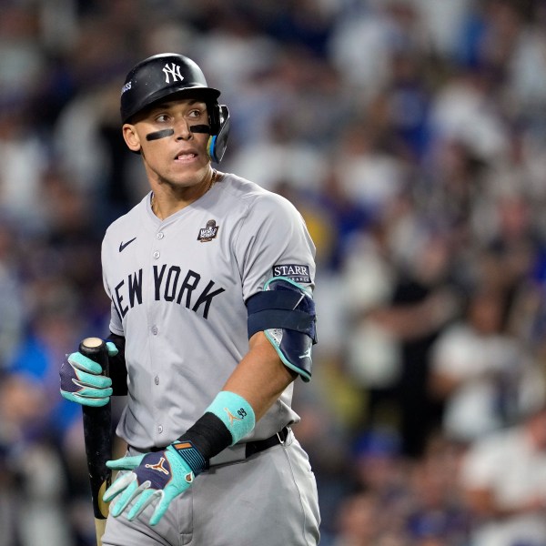 New York Yankees' Aaron Judge walks back to the dugout after striking out against the Los Angeles Dodgers during the ninth inning in Game 2 of the baseball World Series, Saturday, Oct. 26, 2024, in Los Angeles. (AP Photo/Godofredo A. Vásquez)