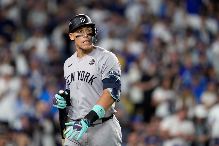 New York Yankees' Aaron Judge walks back to the dugout after striking out against the Los Angeles Dodgers during the ninth inning in Game 2 of the baseball World Series, Saturday, Oct. 26, 2024, in Los Angeles. (AP Photo/Godofredo A. Vásquez)