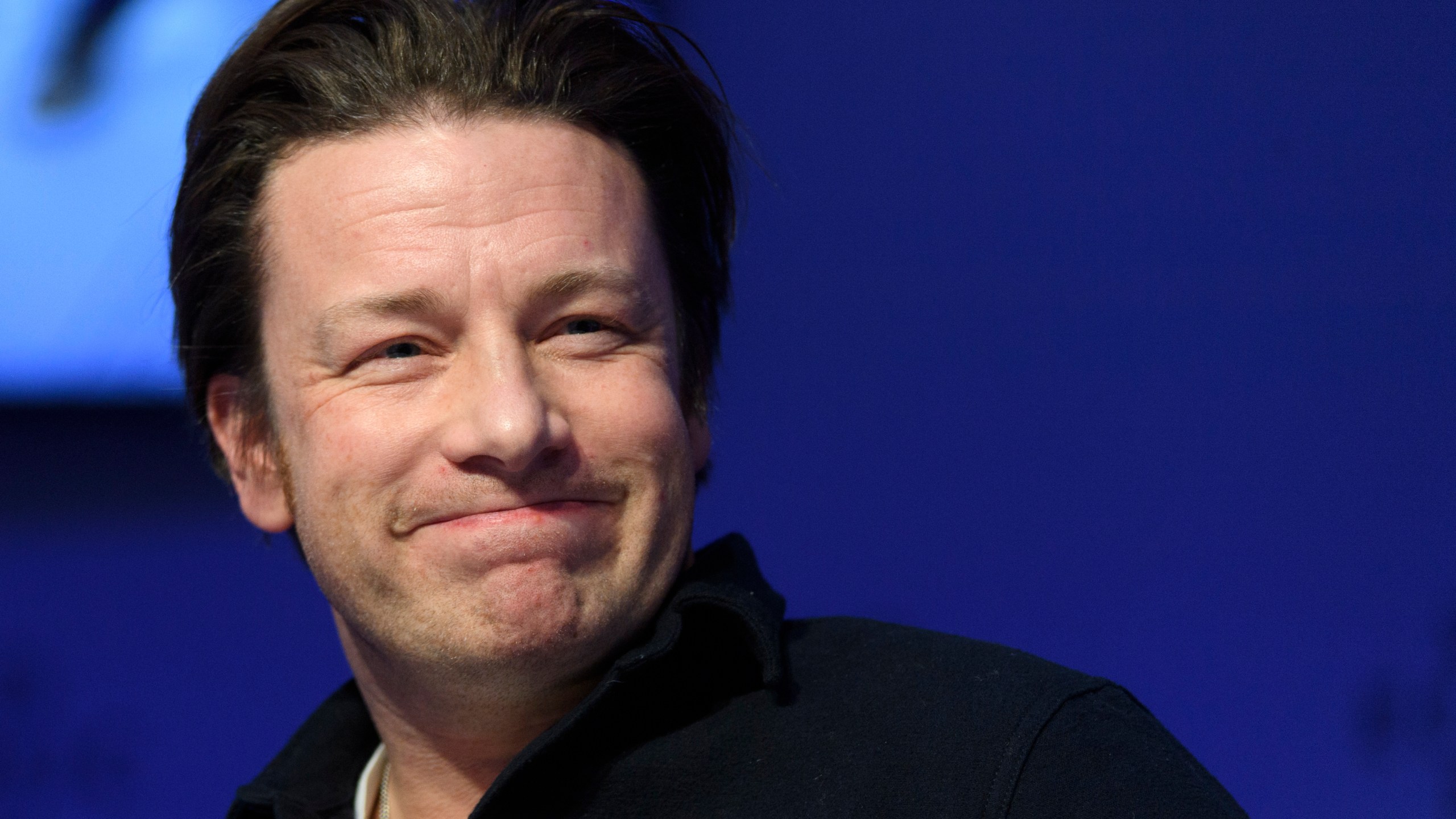 FILE - British chef Jamie Oliver attends a panel session during the 47th annual meeting of the World Economic Forum, WEF, in Davos, Switzerland, Jan. 18, 2017. (Laurent Gillieron/Keystone via AP, file)