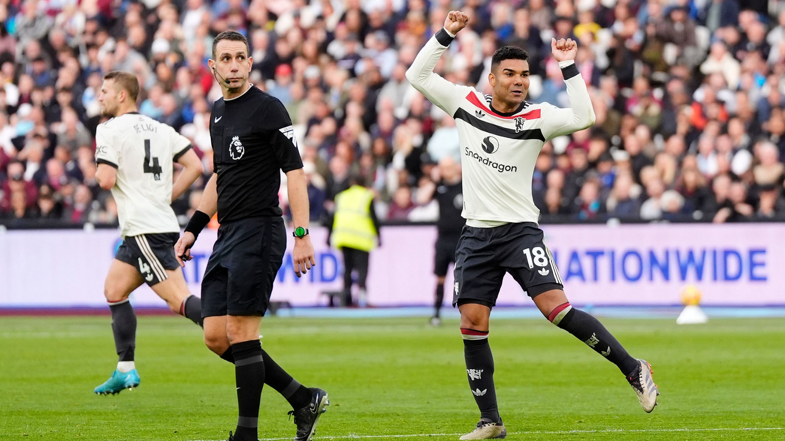 Manchester United's Casemiro celebrates scoring his side's first goal during the English Premier League soccer match between West Ham United and Manchester United at the London Stadium in London, Sunday, Oct. 27, 2024. (Nick Potts/PA via AP)