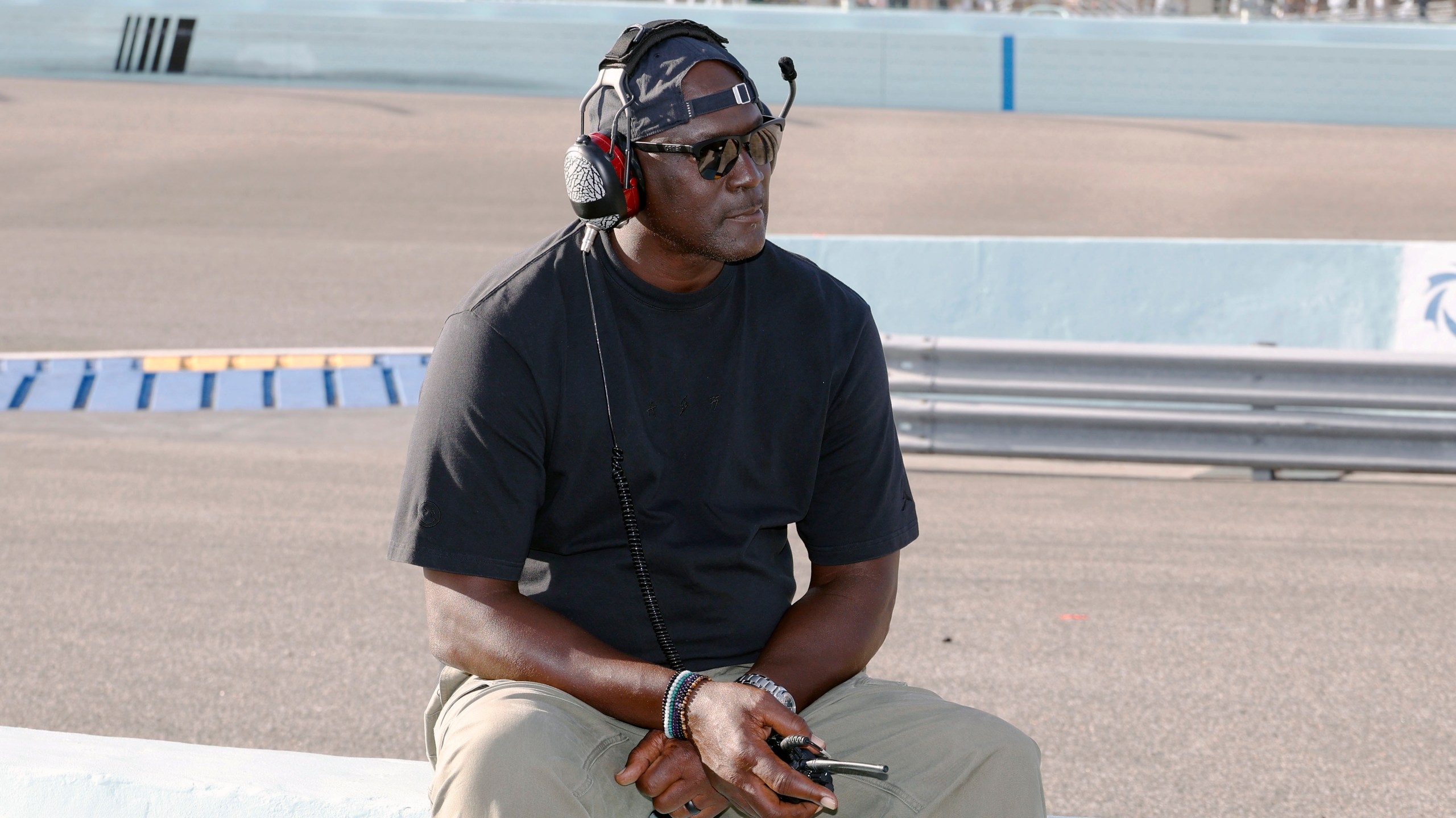 Car owner Michael Jordan watches from the pits during a NASCAR Cup Series auto race at Homestead-Miami Speedway in Homestead, Fla., Sunday, Oct. 27, 2024. (AP Photo/Terry Renna)