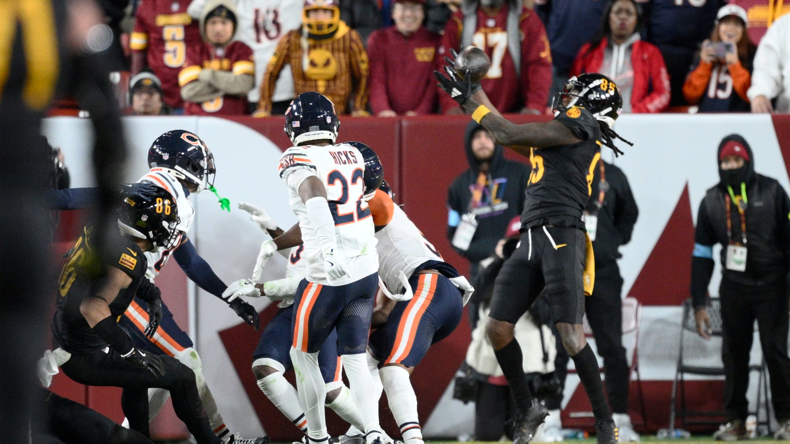 Washington Commanders wide receiver Noah Brown (85) catches a 52-yard touchdown pass in the end zone as time expires to give the Commanders an 18-15 win over the Chicago Bears in an NFL football game Sunday, Oct. 27, 2024, in Landover, Md. (AP Photo/Nick Wass)