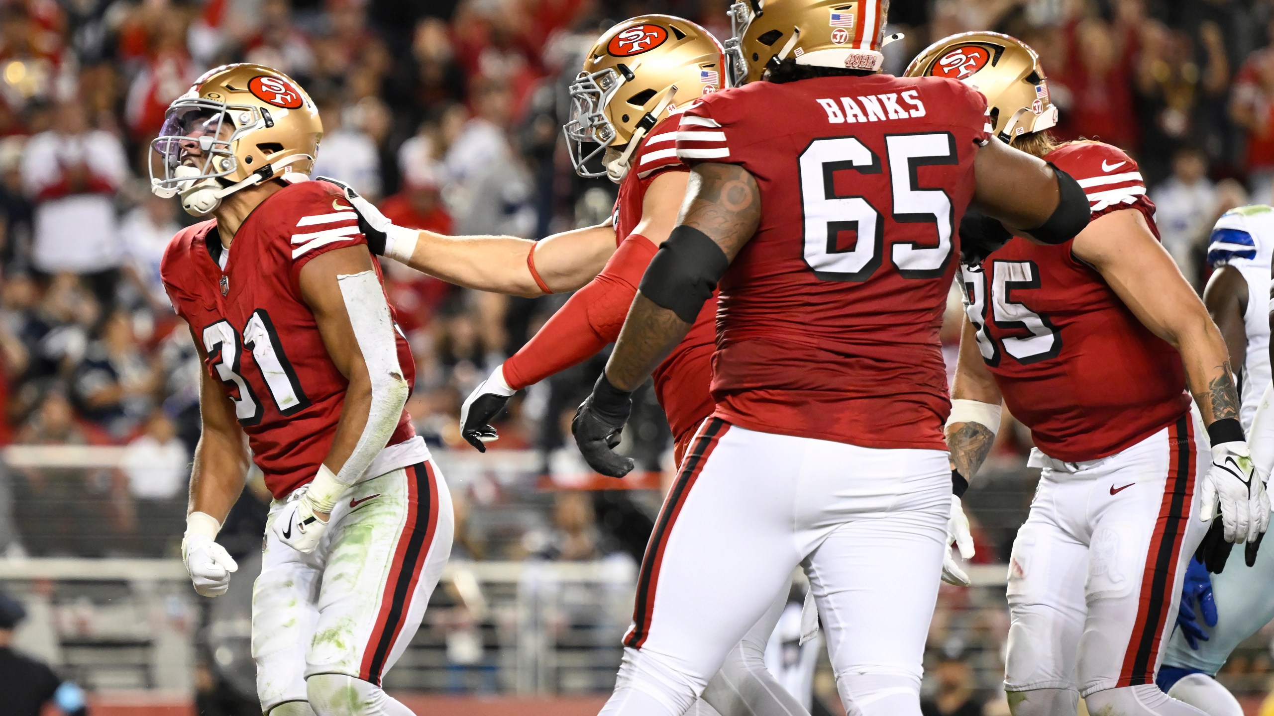 San Francisco 49ers running back Isaac Guerendo (31) celebrates after scoring against the Dallas Cowboys during the second half of an NFL football game in Santa Clara, Calif., Sunday, Oct. 27, 2024. (AP Photo/Eakin Howard)