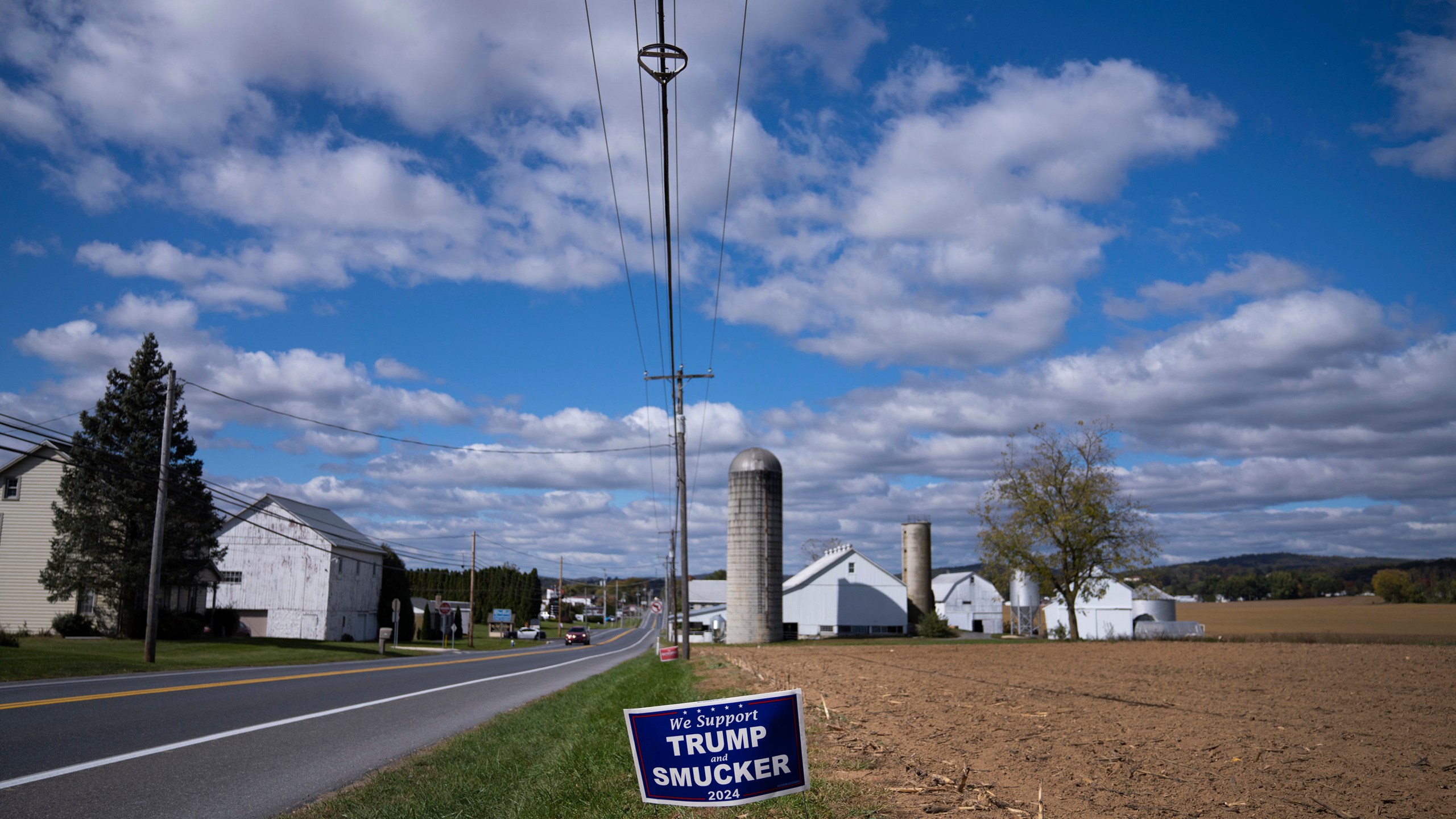 A Republican political advertisement is displayed in Ephrata, Pa., on Wednesday, Oct. 16, 2024. (AP Photo/Jessie Wardarski)