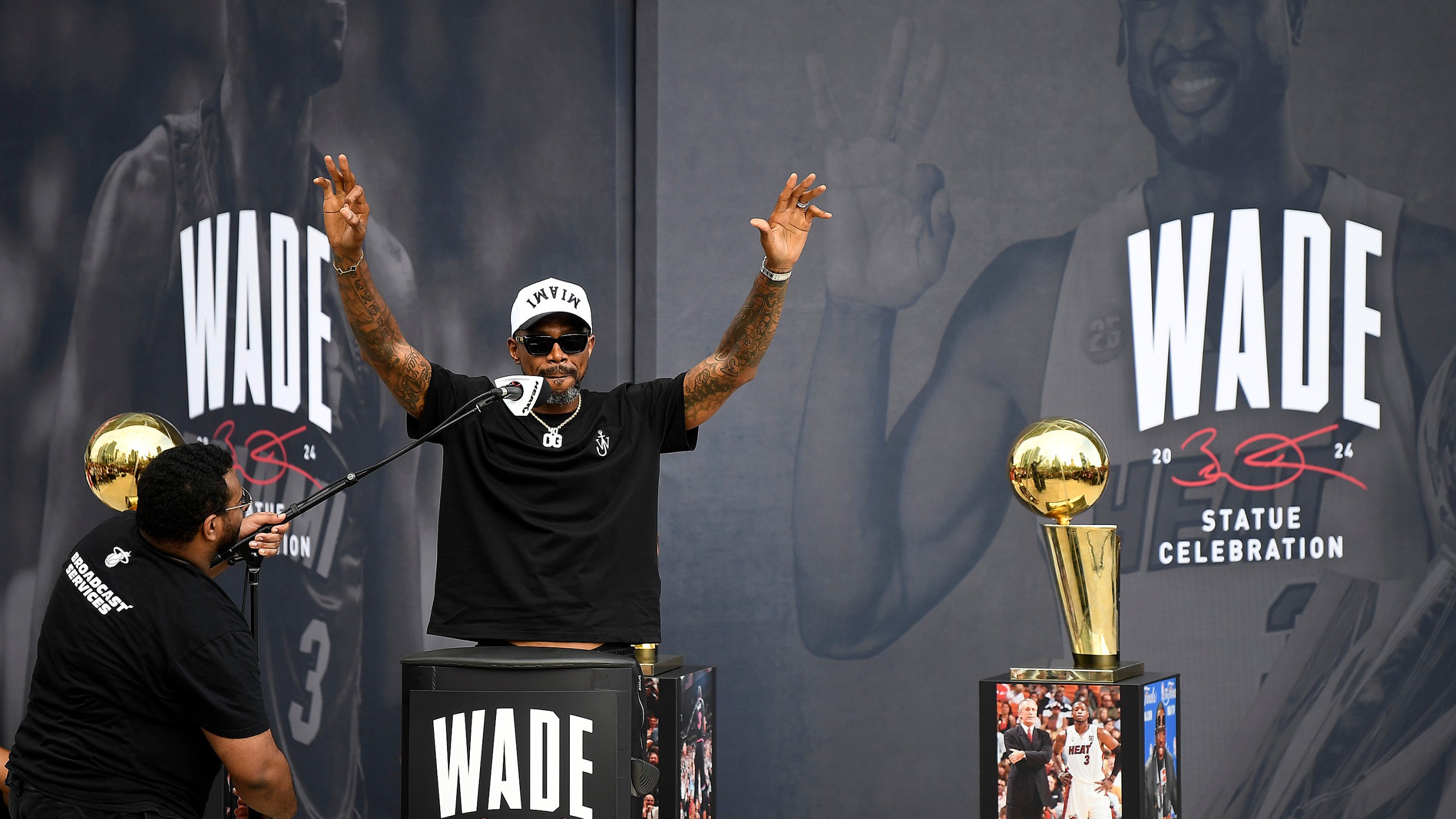 Former Miami Heat NBA basketball player Udonis Haslem, second from left, speaks during a statue unveiling ceremony for former teammate Dwyane Wade outside the Kaseya Center, Sunday, Oct. 27, 2024, in Miami, Fla. (AP Photo/Michael Laughlin)