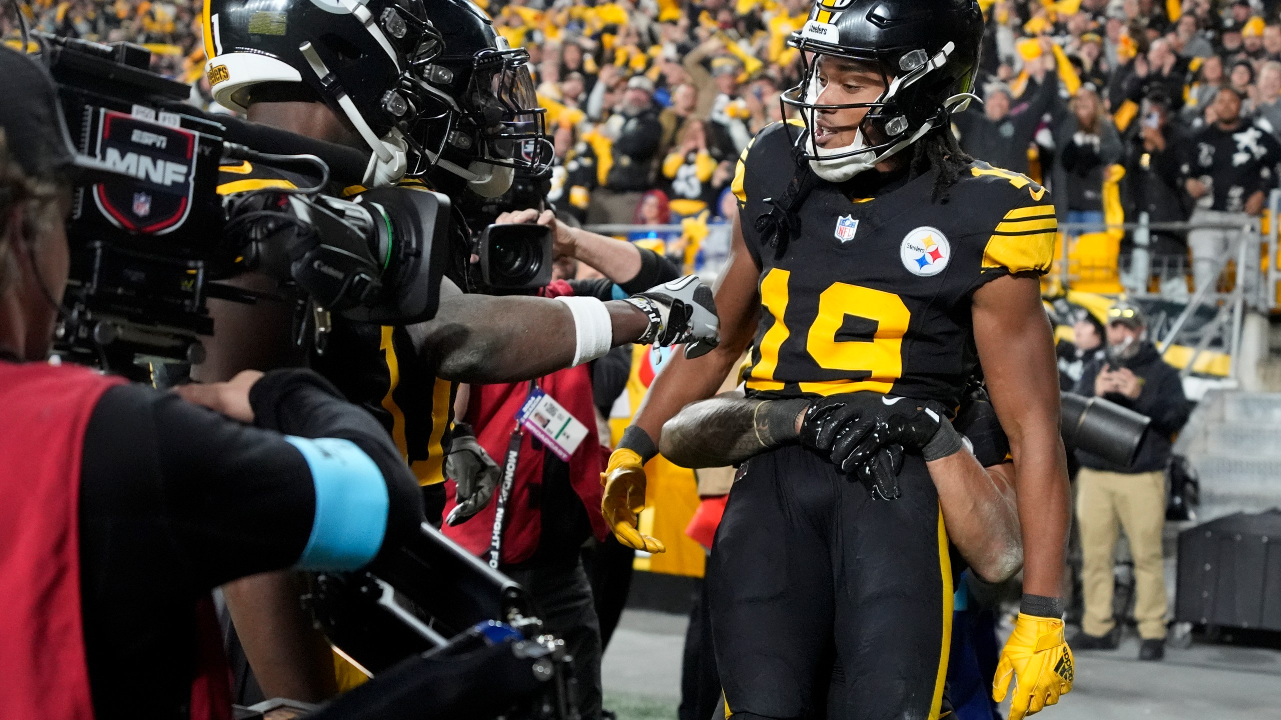 Pittsburgh Steelers wide receiver Calvin Austin III (19) celebrates his touchdown catch with teammates during the second half of an NFL football game against the New York Giants, Monday, Oct. 28, 2024, in Pittsburgh. (AP Photo/Gene J. Puskar)