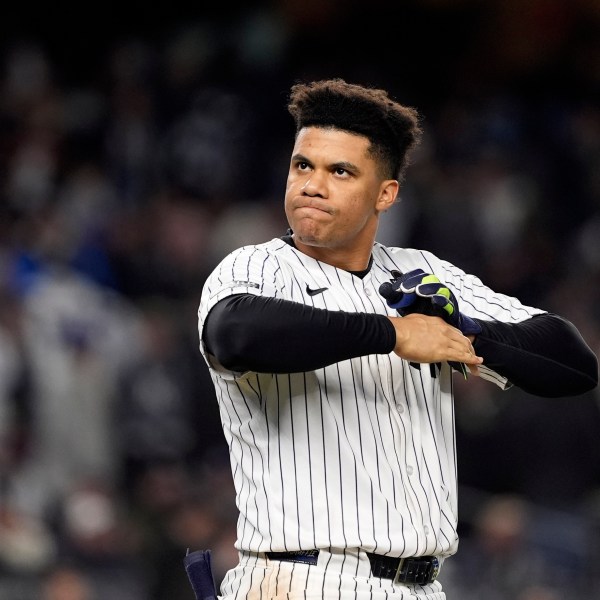 New York Yankees' Juan Soto takes off his batting gloves after grounding out against the New York Yankees to end the third inning in Game 3 of the baseball World Series, Monday, Oct. 28, 2024, in New York. (AP Photo/Godofredo A. Vásquez)