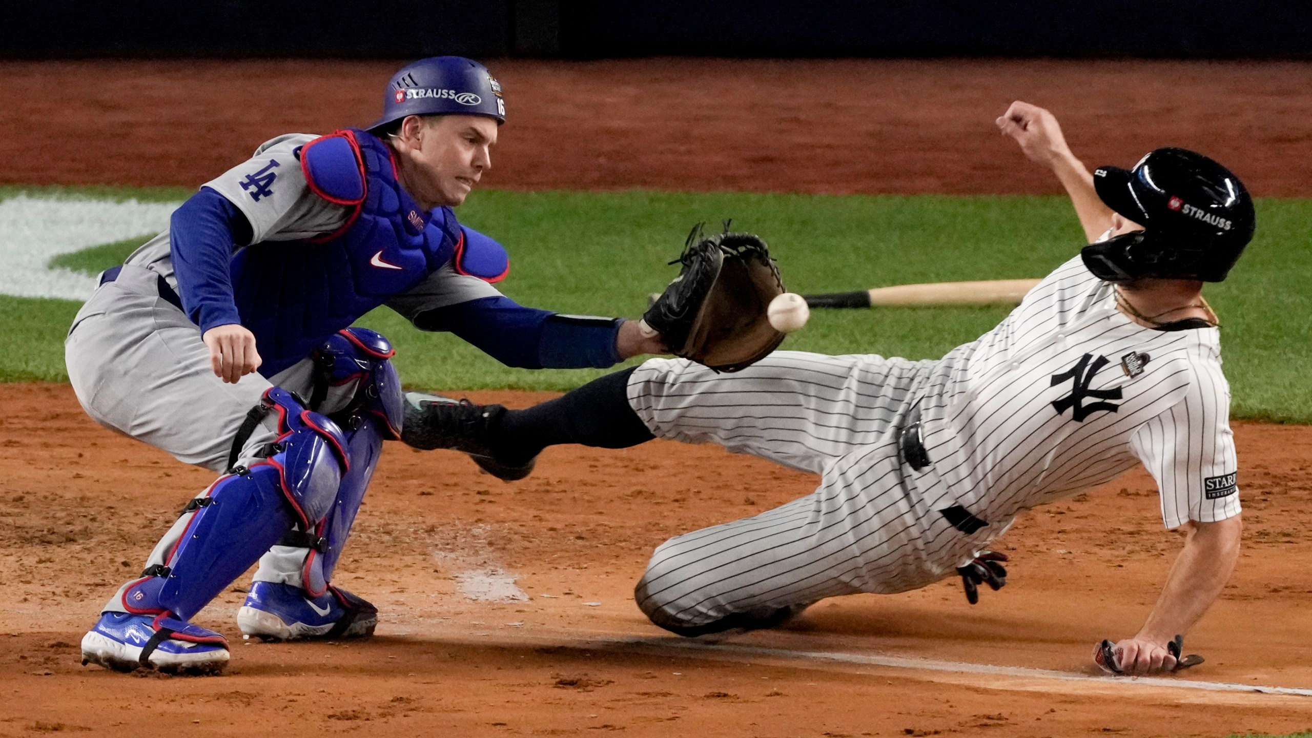 New York Yankees' Giancarlo Stanton is tagged out at home by Los Angeles Dodgers catcher Will Smith during the fourth inning in Game 3 of the baseball World Series, Monday, Oct. 28, 2024, in New York. (AP Photo/Frank Franklin II)