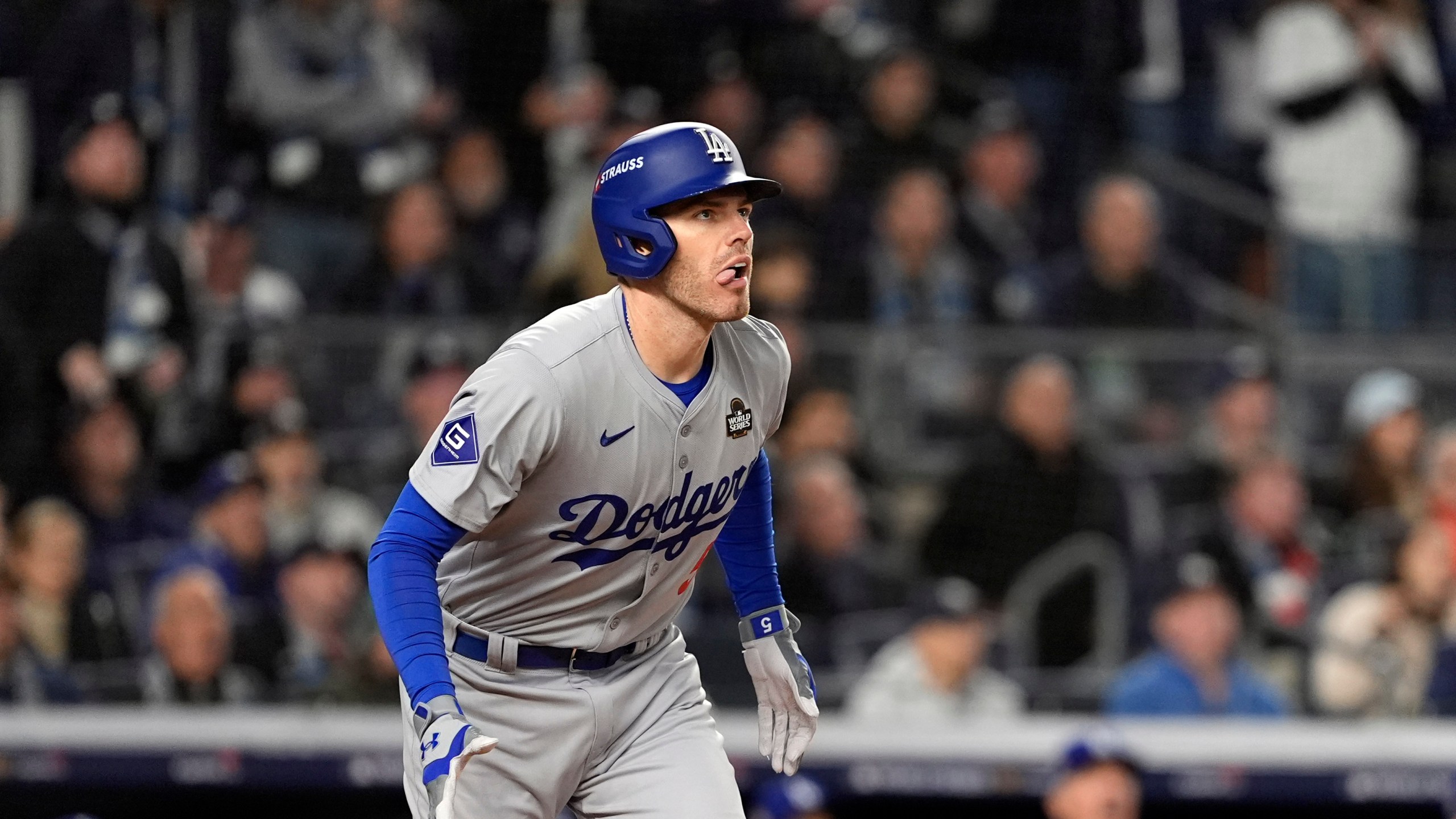 Los Angeles Dodgers' Freddie Freeman watches his two-run home run against the New York Yankees during the first inning in Game 3 of the baseball World Series, Monday, Oct. 28, 2024, in New York. (AP Photo/Godofredo A. Vásquez)