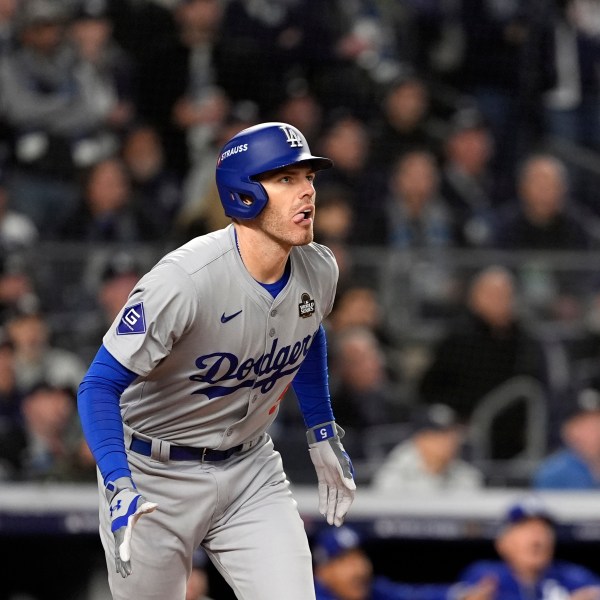 Los Angeles Dodgers' Freddie Freeman watches his two-run home run against the New York Yankees during the first inning in Game 3 of the baseball World Series, Monday, Oct. 28, 2024, in New York. (AP Photo/Godofredo A. Vásquez)