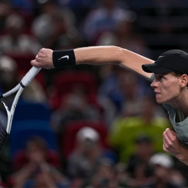 Jannik Sinner of Italy serves his winning shot against Novak Djokovic of Serbia during the men's singles match in the Shanghai Masters tennis tournament at Qizhong Forest Sports City Tennis Center in Shanghai, China, Sunday, Oct. 13, 2024. (AP Photo/Andy Wong)